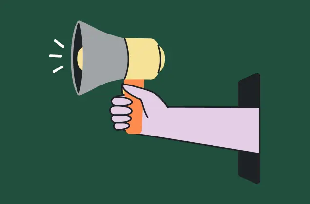 A hand holding a megaphone